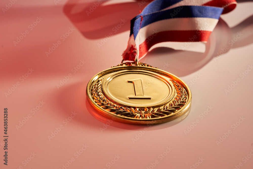gold medal on pink background gold medal on pink background