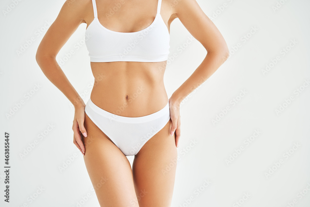 Perfect sporty body in white underwear of young woman Stock Photo