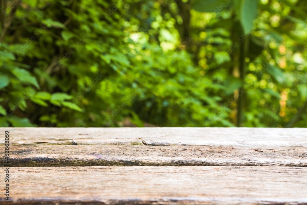 Empty dark wooden table in front of abstract blurred bokeh background Empty dark wooden table in front of abstract blurred bokeh background
