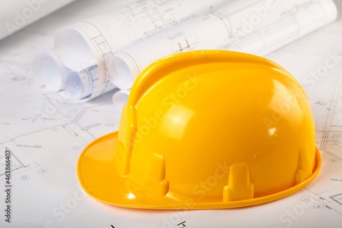 Safety Helmet And Construction Plans Close-up