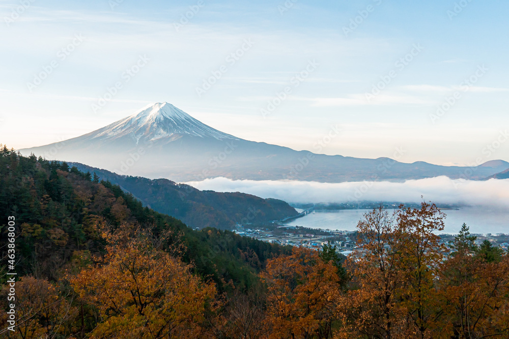 Mount Fuji, Lake Kawaguchi, and red maple trees during the autumn foliage season in Kawaguchiko, Japan.