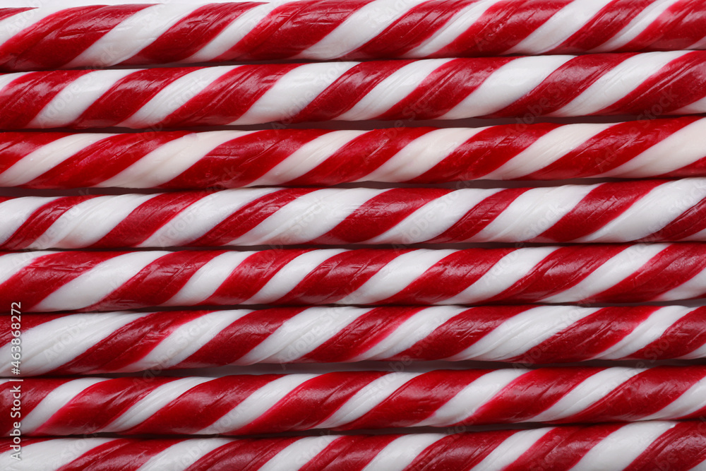 Fototapeta premium Top view of many sweet Christmas candy canes as background, closeup