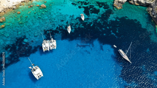 Aerial drone photo of iconic paradise bay and rocky beach of Erimitis in island of Paxos visited by luxury yachts and sail boats, Ionian, Greece © aerial-drone