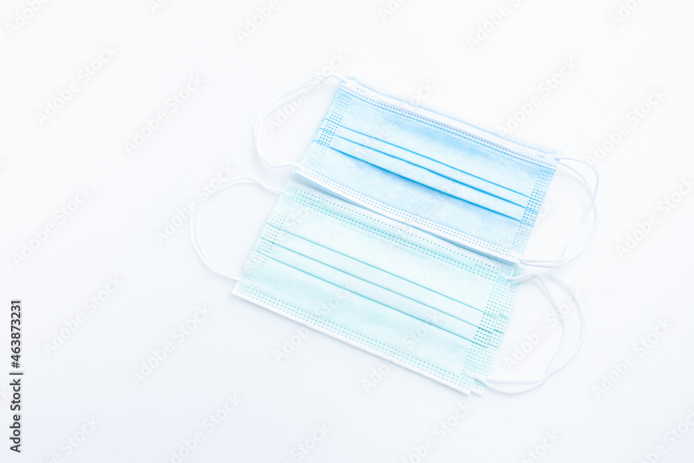 Top view medical mask isolated on white background with copy space. Concept wearing medical mask for protection virus, and distance. Top view medical mask isolated on white background with copy space. Concept wearing medical mask for protection virus, and distance.