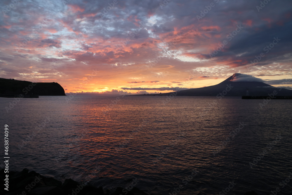 The dawn lights illuminate the island of Pico and its volcano, Pico island, Azores