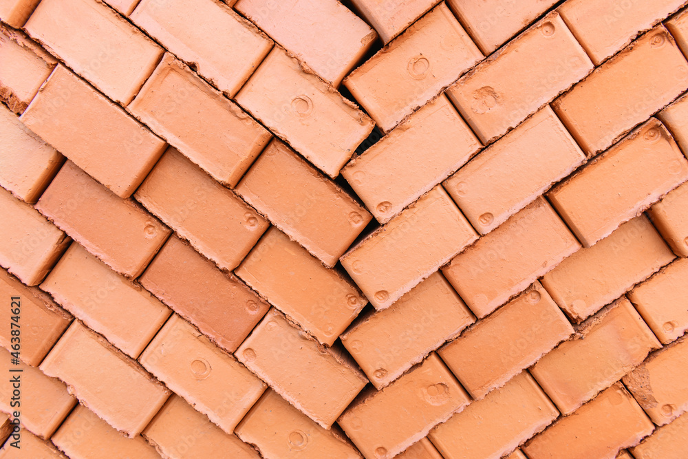 Red and orange brick wall. Brick texture, close up