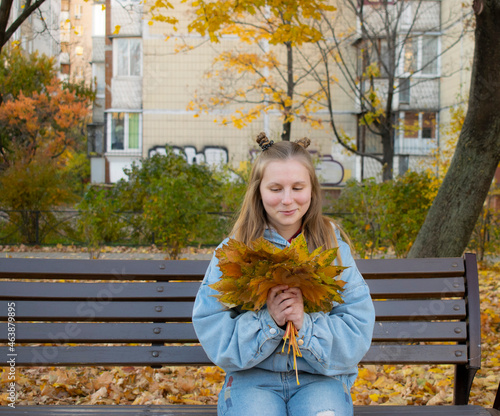 woman sitting on a bench in the park