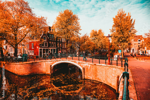 Photography postcard picture of beautiful canals and traditional Dutch buildings in Amsterda