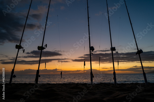 Fishing rods over a beautiful seascape. Sanset on sea.