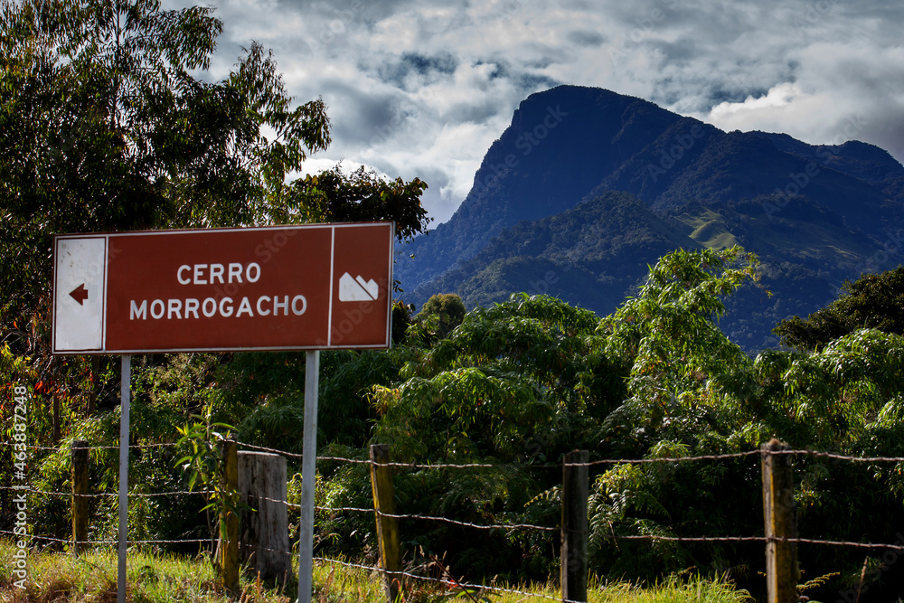 Fototapeta premium The famous Morrogacho Hill located on the beautiful Cocora Valley at the region of Quindio in Colombia. On the sign you can read: Morrogacho Hill