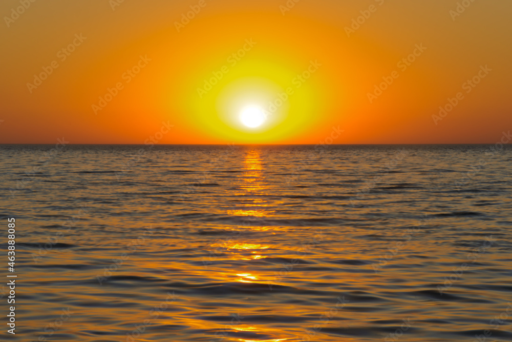Sunset over the calm waters of the sea Sunset over the calm waters of the sea