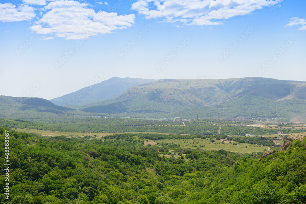 Settlement in the green valley between the mountains