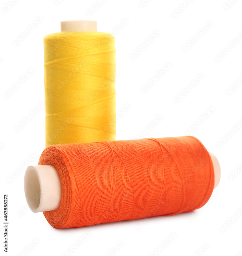 Different colorful sewing threads on white background Different colorful sewing threads on white background
