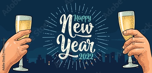 Female and male hands holding and clinking with two glasses champagne.