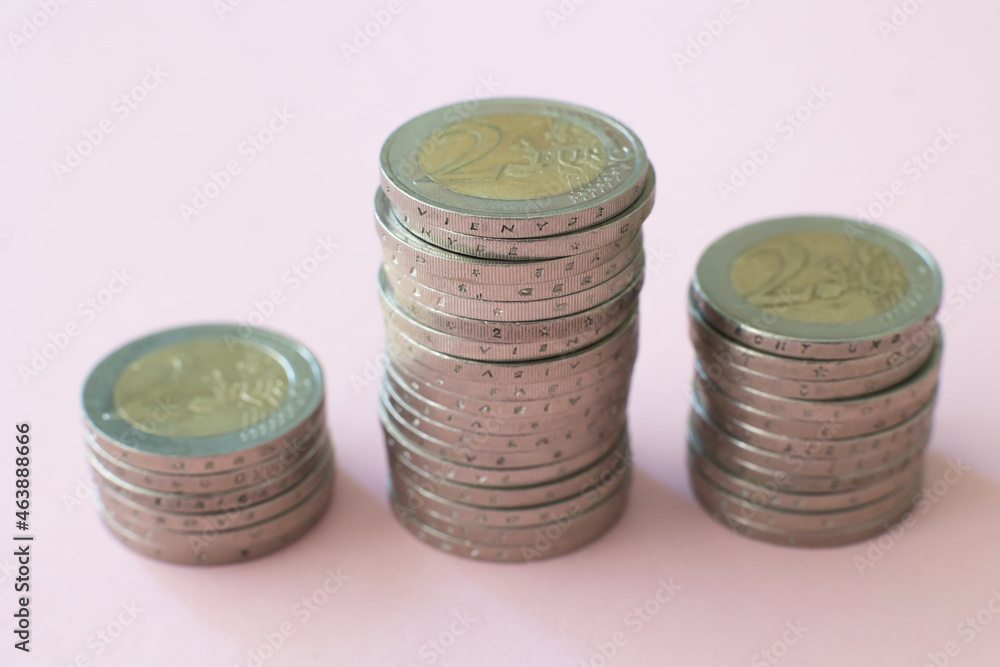 Euro coins in a stack Financial profit uphill on a pink background Cash income Euro coins in a stack Financial profit uphill on a pink background Cash income