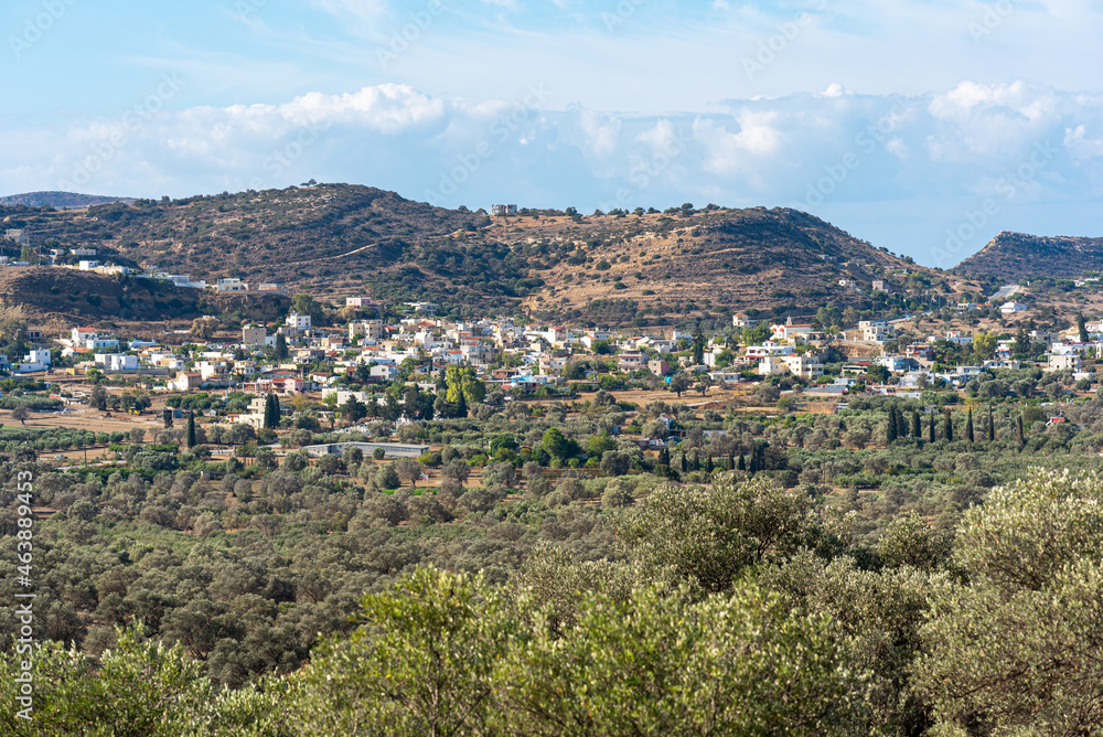 View to the village Pitsidia, located hillside near the mediterranean sea and at the end of Messara plain in the south of Crete. Despite the tourism it has kept its original rural character