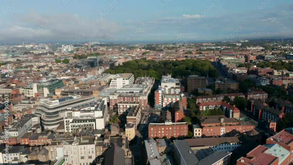 Fly above large town, red brick buildings along streets near St Stephens Green park. Dublin, Ireland Fly above large town, red brick buildings along streets near St Stephens Green park. Dublin, Ireland