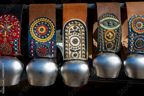 Slika na platnu Traditional alpine cow bells on display