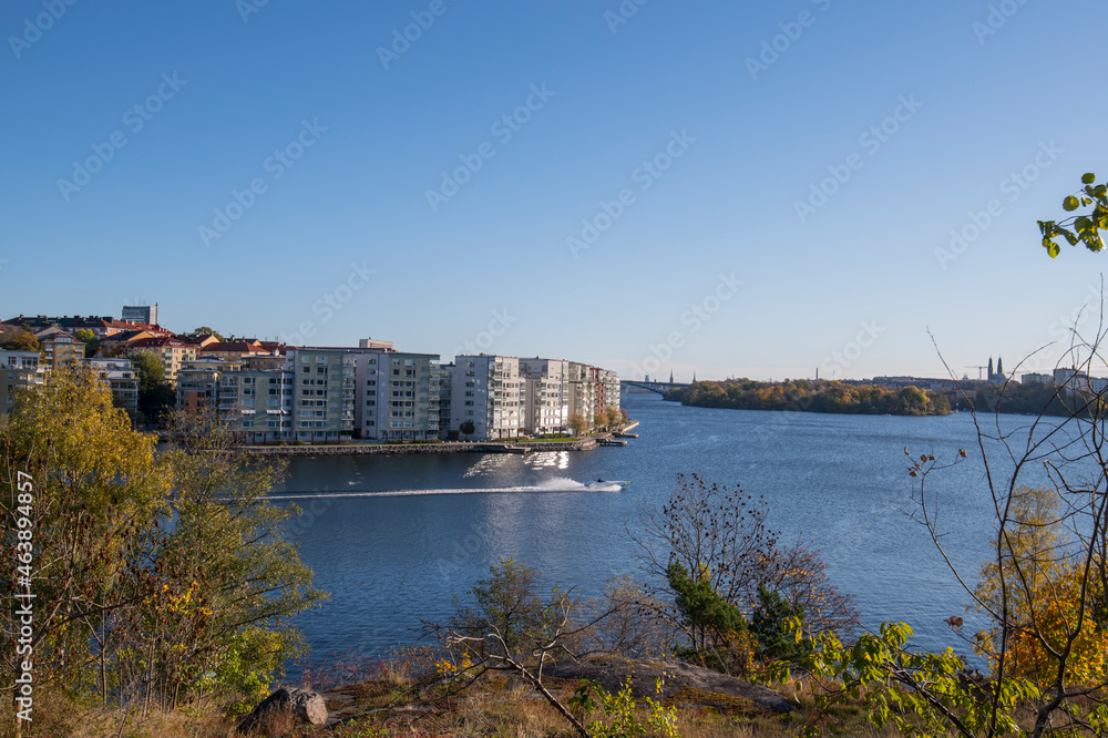 View over the lake Mälaren at the islands Essingeöarna and the skyline of Stockholm a colorful autumn day in Stockholm