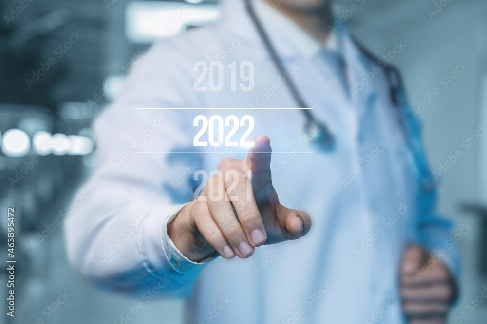 Doctor clicks on new year 2022 . Doctor clicks on new year 2022 .