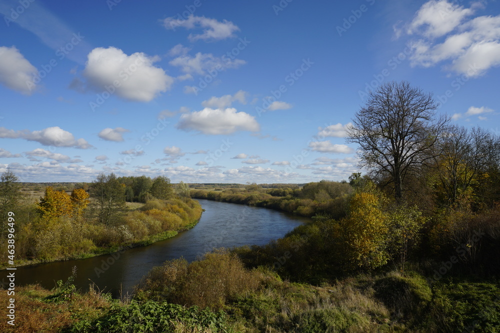 Sunny day in October. Golden autumn. The view is not the Neman River. Horizontal landscape