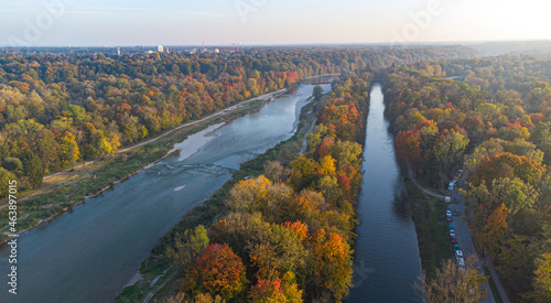 Aerial views of autumn in Munich. Isar river seen from above with colorful trees nearby photo