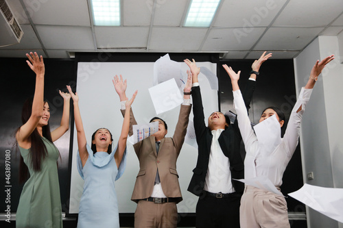 Cheerful business teamwork throw papers and documents fly in air with big smile . Successful or achievement concept