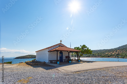 The Orthodox Church of St. Nicholas in Greece, on Kassandra peninsula in Halkidiki, Paliouri - Cape Kanistro. Summer day with clear blue sky in background.