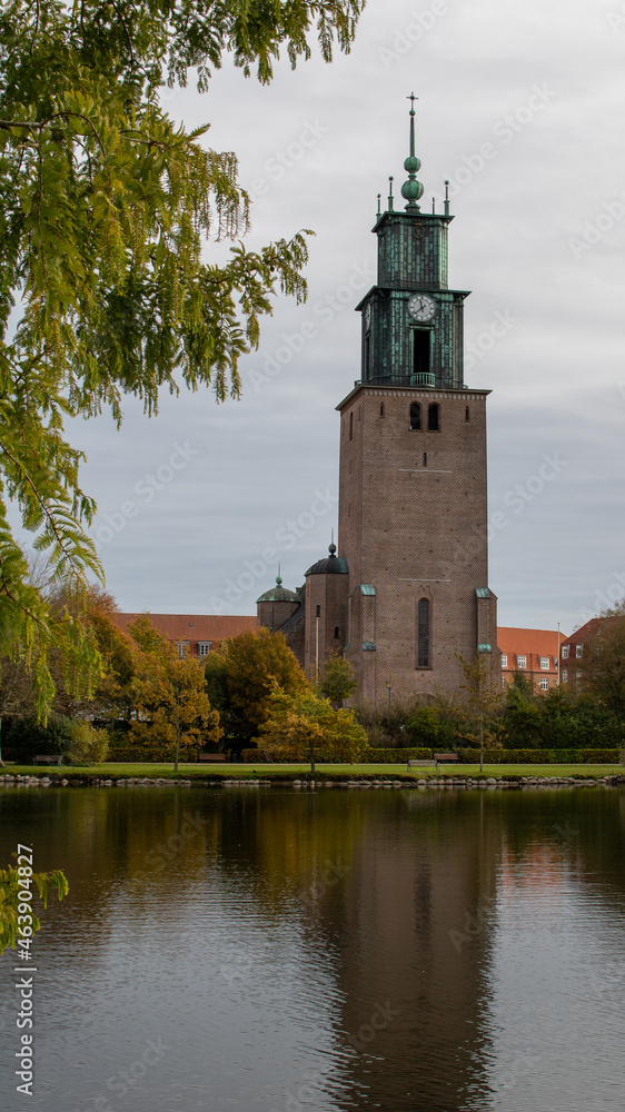 St. Mark's Church in Aalborg and its reflection in the park's lake. A beautiful green oasis in the middle of Aalborg.
