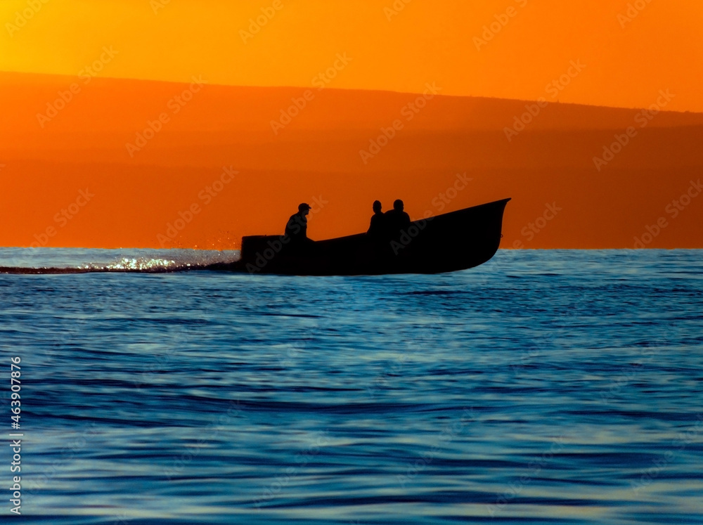 Fishing boat on the water at dusk