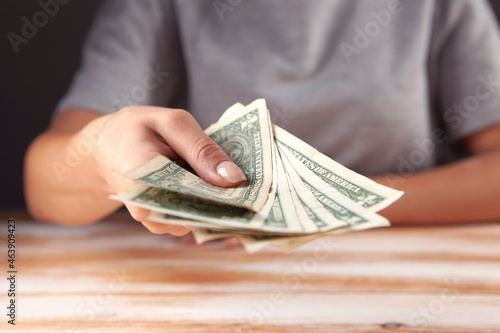 Female hand holding money dollars US