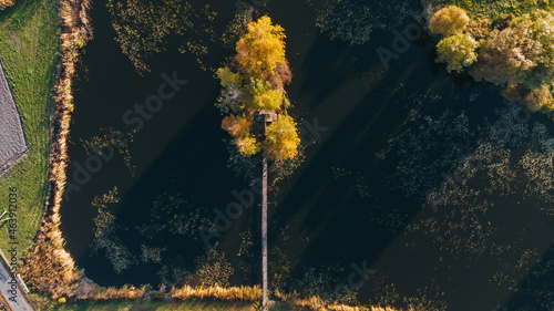 Fishermans House in autumn, vertical aerial view, Staryi Solotvyn, Ukraine photo