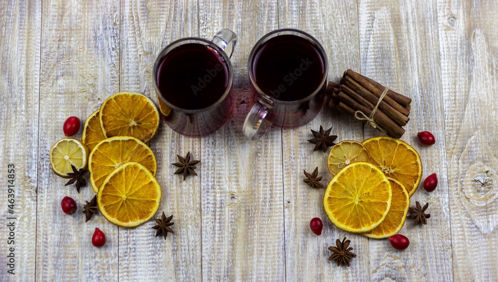 glasses with mulled wine on a wooden background. new year concept