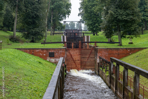 Old navigable river lock of the 20th century with mechanical control. Augustow Canal, Belarus