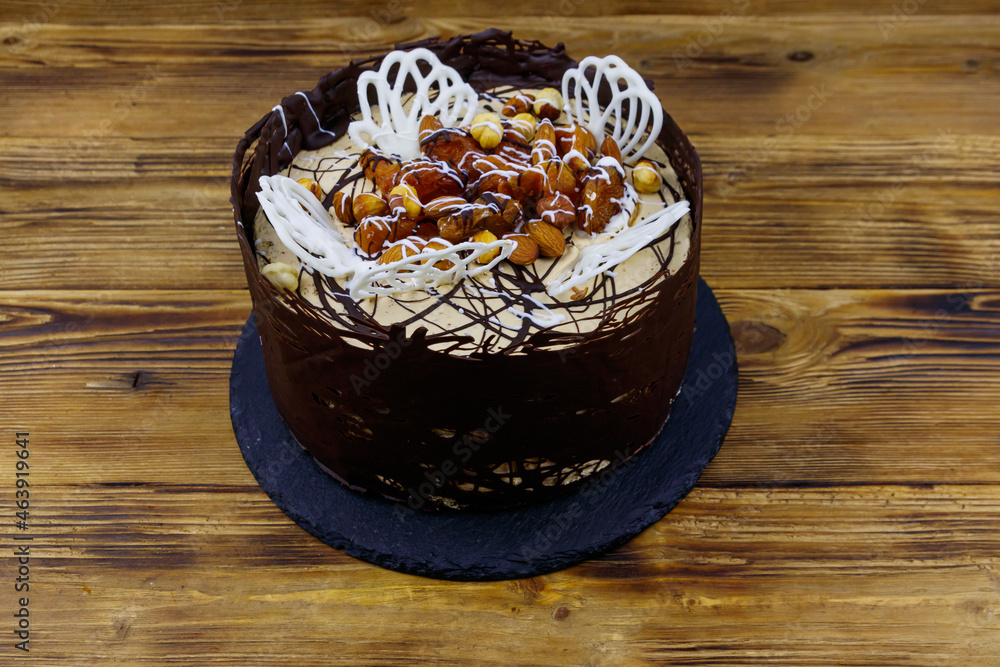 Tasty chocolate cake on a wooden table Tasty chocolate cake on a wooden table