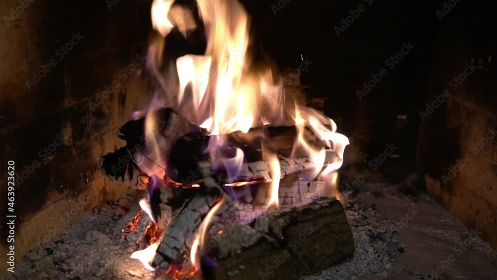 Firewood burning in the fireplace. A blazing fire inside the stove. Beautiful burning of palen Firewood burning in the fireplace. A blazing fire inside the stove. Beautiful burning of palen