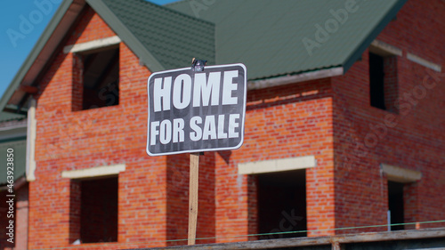 Home For Sale sign inscription note tag message on paper. For real estate company, buy and sell cheap house property, moving sign with house on background. Copy space. Advertising. Selling apartment