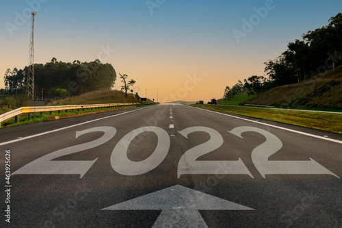 Wallpaper Mural Empty asphalt road and New Year 2022 concept. Driving on an empty road to 2022 goals with the sunset. Torontodigital.ca