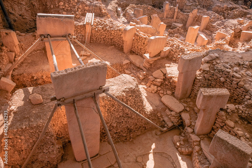 Gobeklitepe ruins view in Sanliurfa Province of Turkey. Gobeklitepe, whose construction dates back to 10000 B.C., is known as the oldest and largest center of worship in history. photo