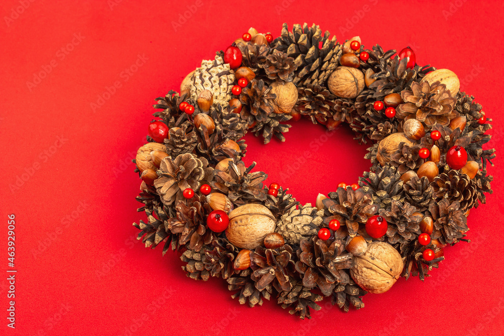 Autumn wreath of cones, nuts, and berries. Creative composition, the handmade