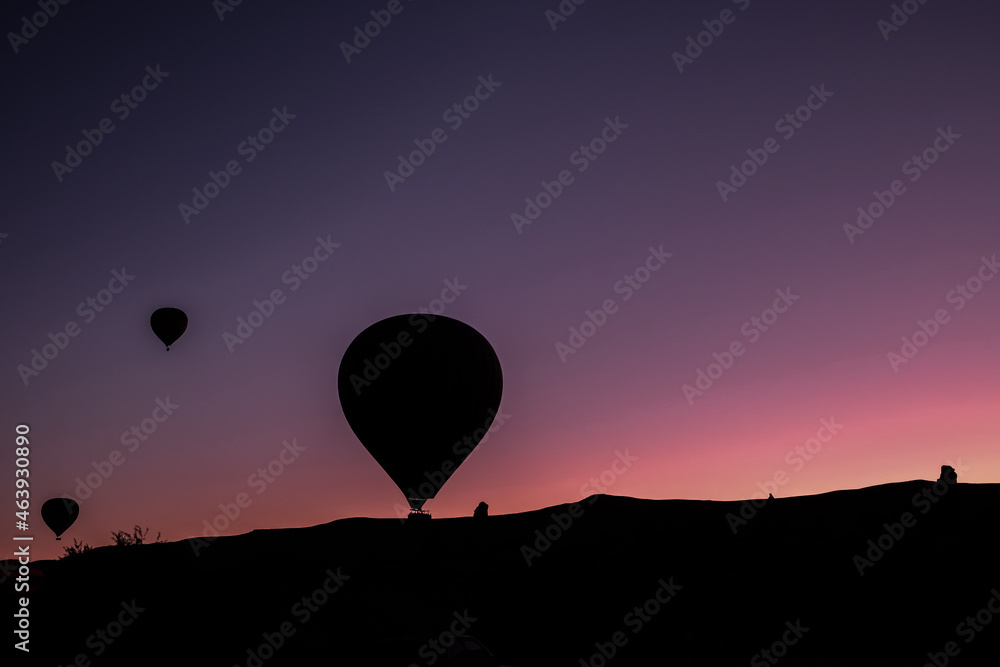 Hot air balloon flying over spectacular Cappadocia. Hot air balloon flying over spectacular Cappadocia Hot air balloon flying over spectacular Cappadocia. Hot air balloon flying over spectacular Cappadocia