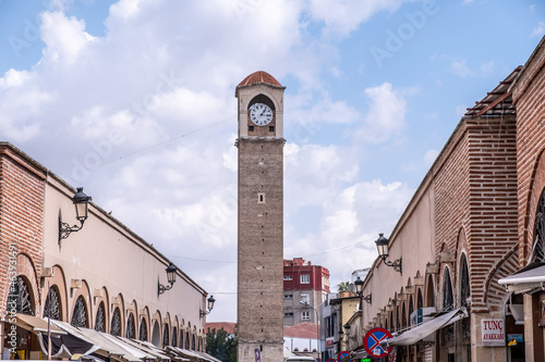 Photography Old clock tower with blue and clouds sky in Adana, Turkey.