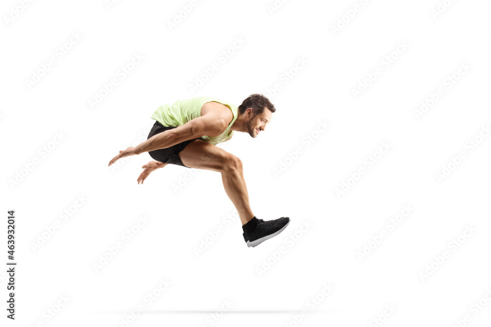 Full length profile shot of a male athlete performing a long jump - obrazy, fototapety, plakaty 