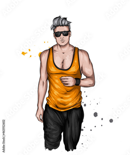 Handsome muscular guy with stylish hair, beard and tattoos. Hipster. Fashion and style, clothing and accessories.
