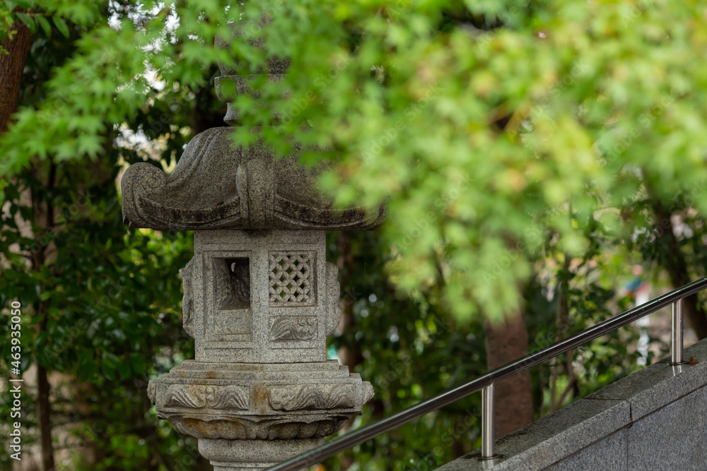 religious stone lantern covered autumn tree leaves in shinto shrine religious stone lantern covered autumn tree leaves in shinto shrine