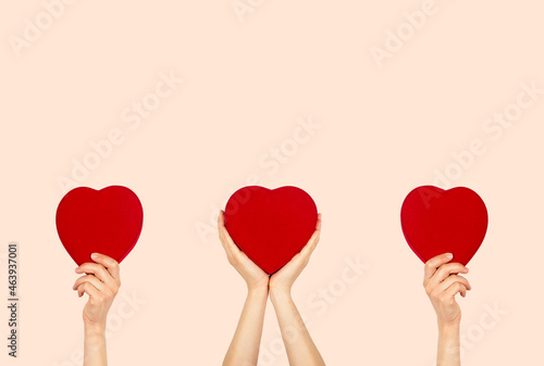 Love, health and charity concept. Woman holding heart shaped box.