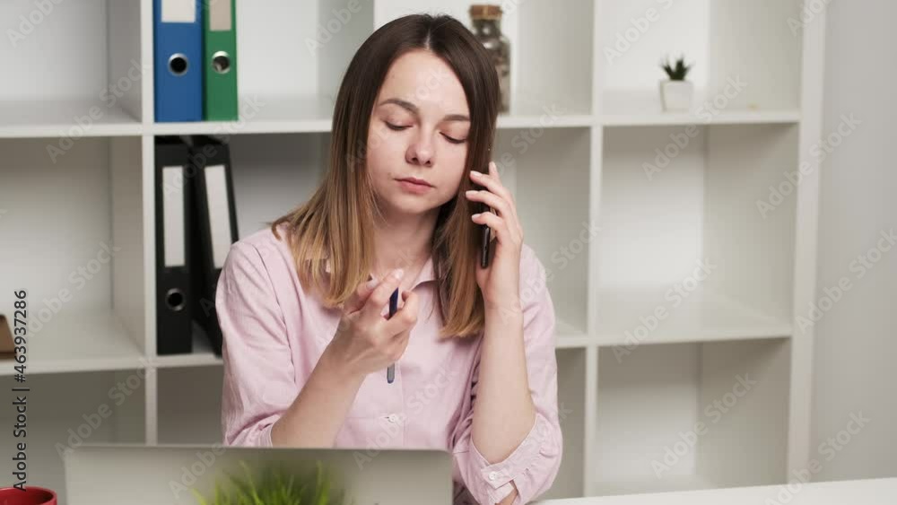 Annoyed person talking mobile phone at office Annoyed person talking mobile phone at office