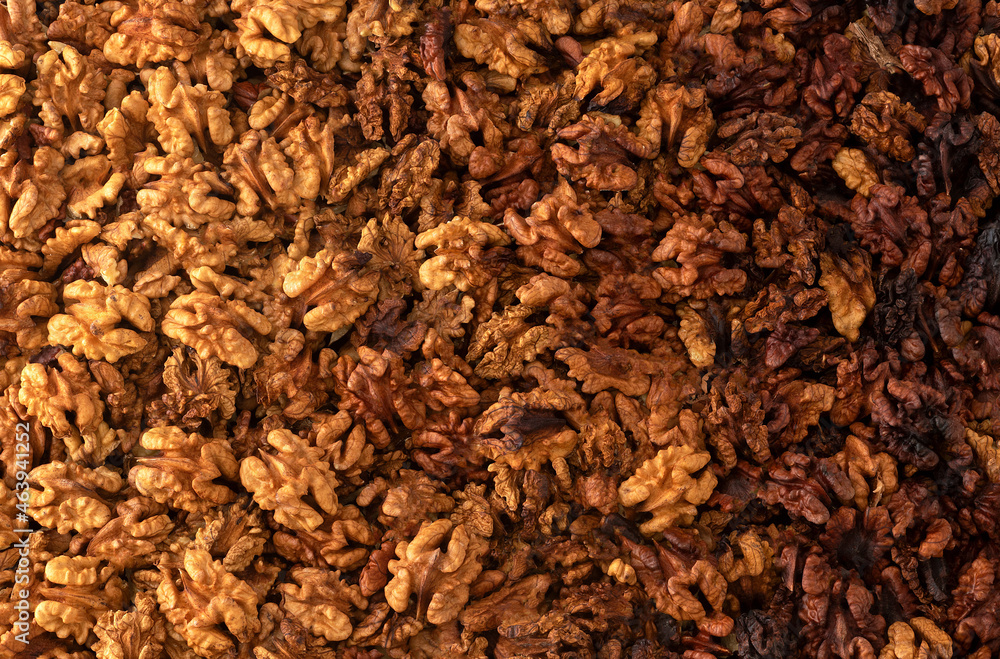 Walnuts background. walnut kernels located bu gredient look. top view.