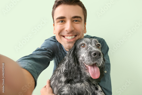 Happy young man with cute d...