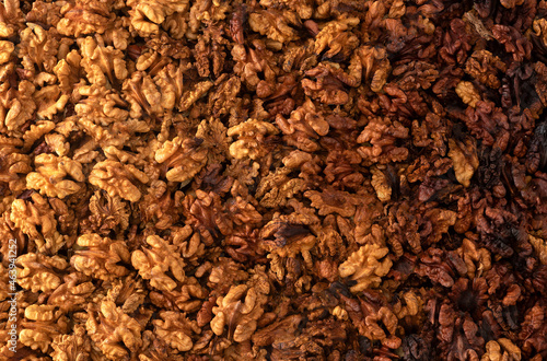 Obraz na płótnie Walnuts background. walnut kernels located bu gredient look. top view.